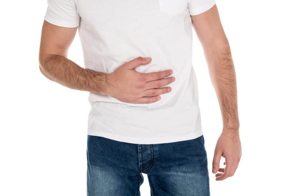 metabolism - man holding his stomach