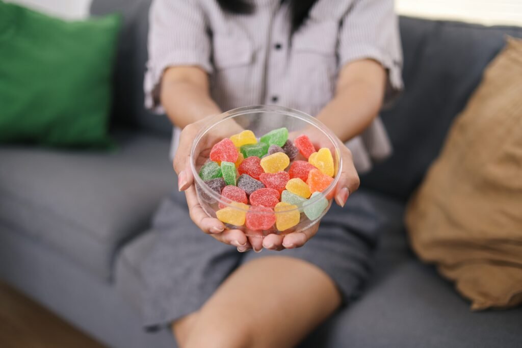 woman holding a bowl of delta-8 gummies