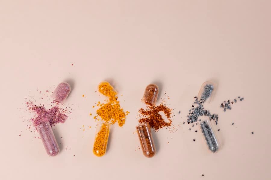 Opened supplement capsules showing natural powdered botanicals like CBD capsule blends