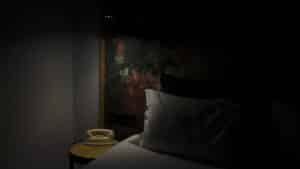 Dimly lit bedroom at night where CBN and CBD routines happen