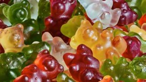 Colorful full spectrum CBD gummies in a close-up pile