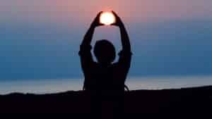 Silhouette framing the sunrise, a calm image for the endocannabinoid system