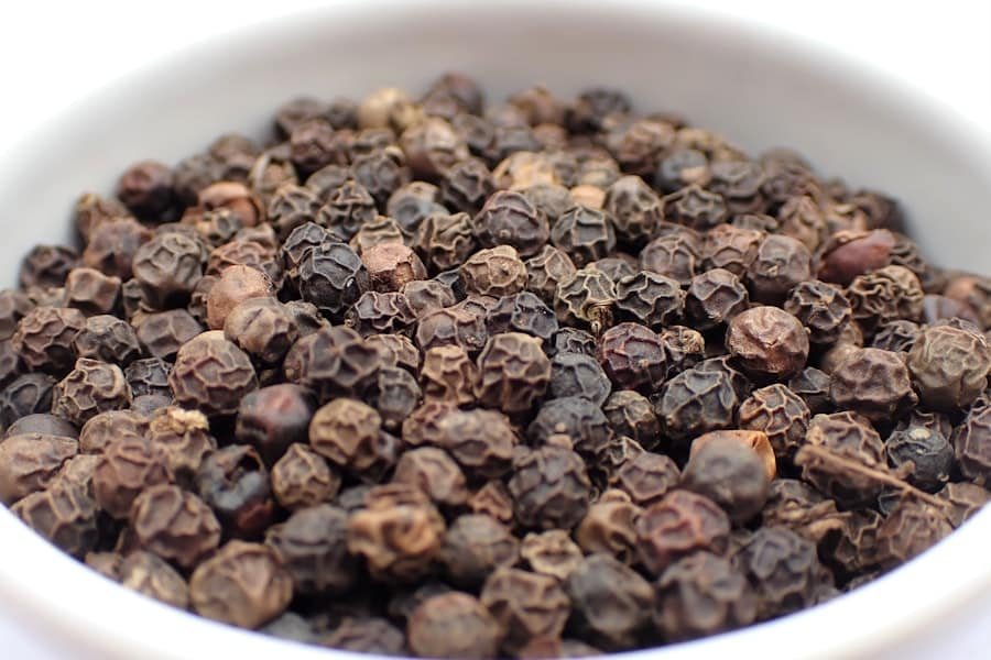 Bowl of black peppercorns rich in the caryophyllene terpene