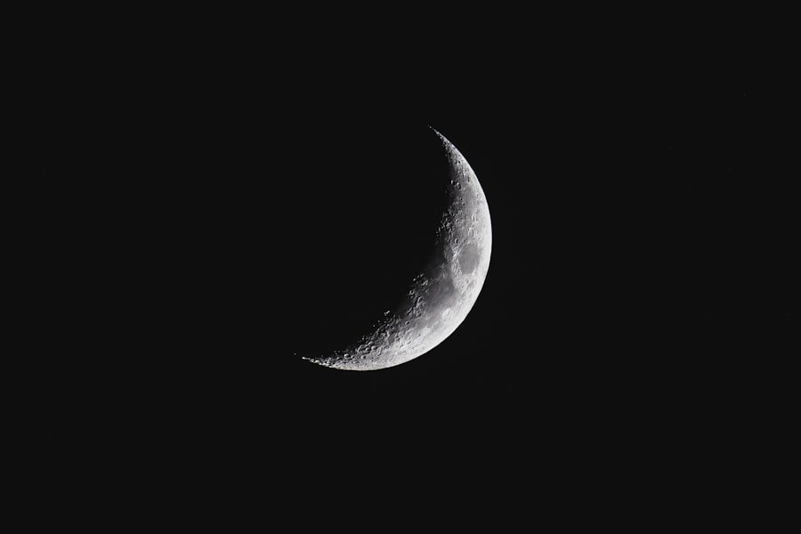 A crescent moon against a dark night sky