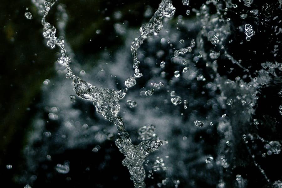 Cold water splashing against a dark background