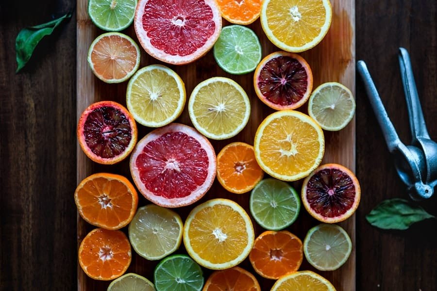 Sliced citrus fruit arranged on a wooden board