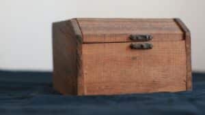 A simple wooden storage box with a hinged lid