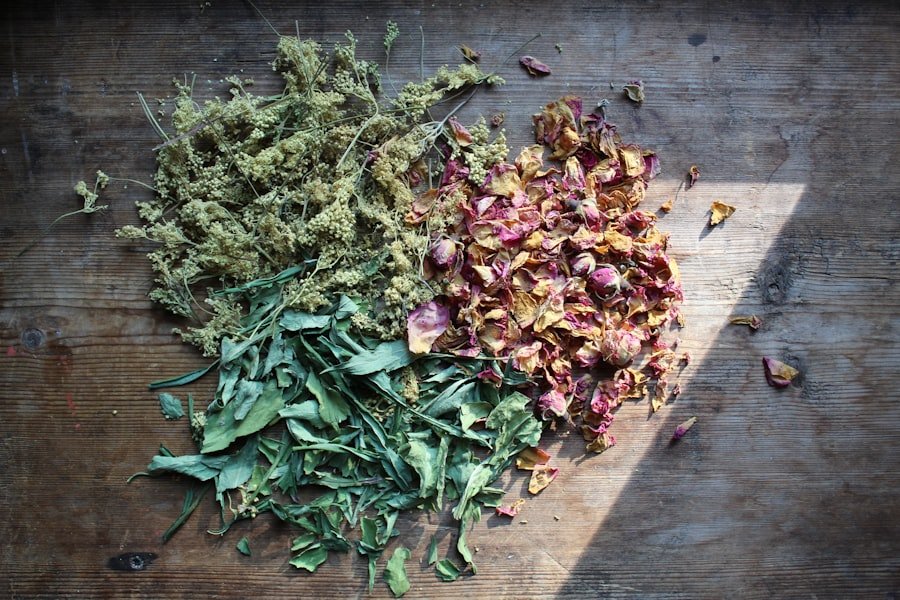 Dried herbs and petals arranged on a wooden surface