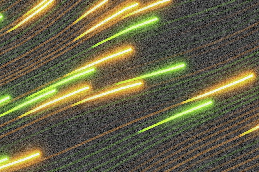Abstract streaks of green and orange light