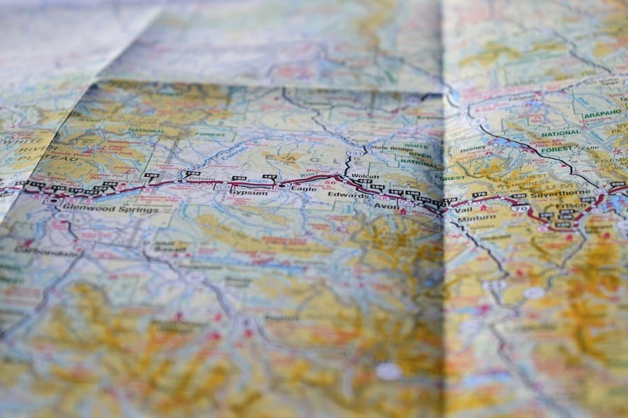 A folded paper road map showing a highway through mountain towns
